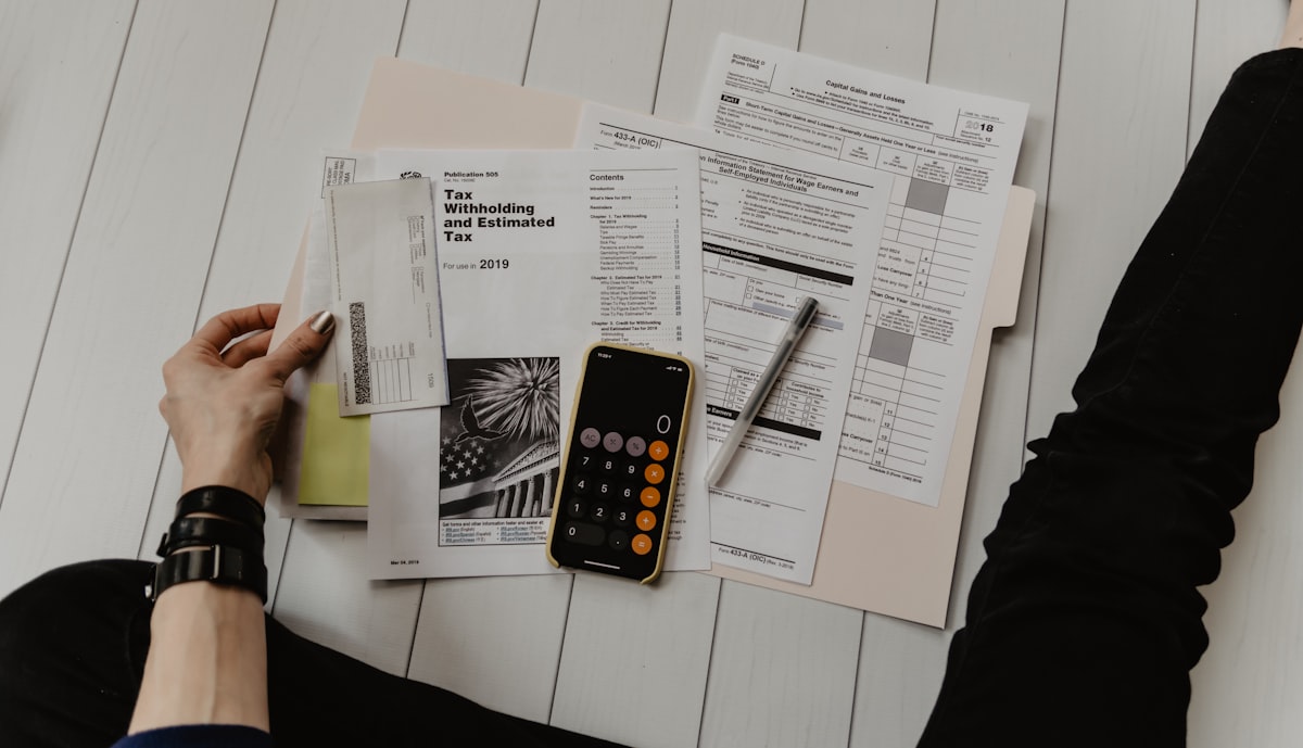 Business professional reviewing invoice and fee documents