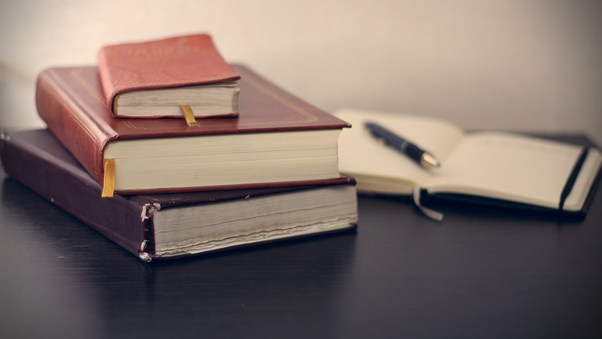 Calculator and invoices representing invoice collection service workflow
